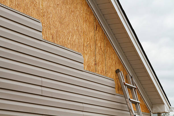 Professional Siding Replacement technician working in La Belle, PA